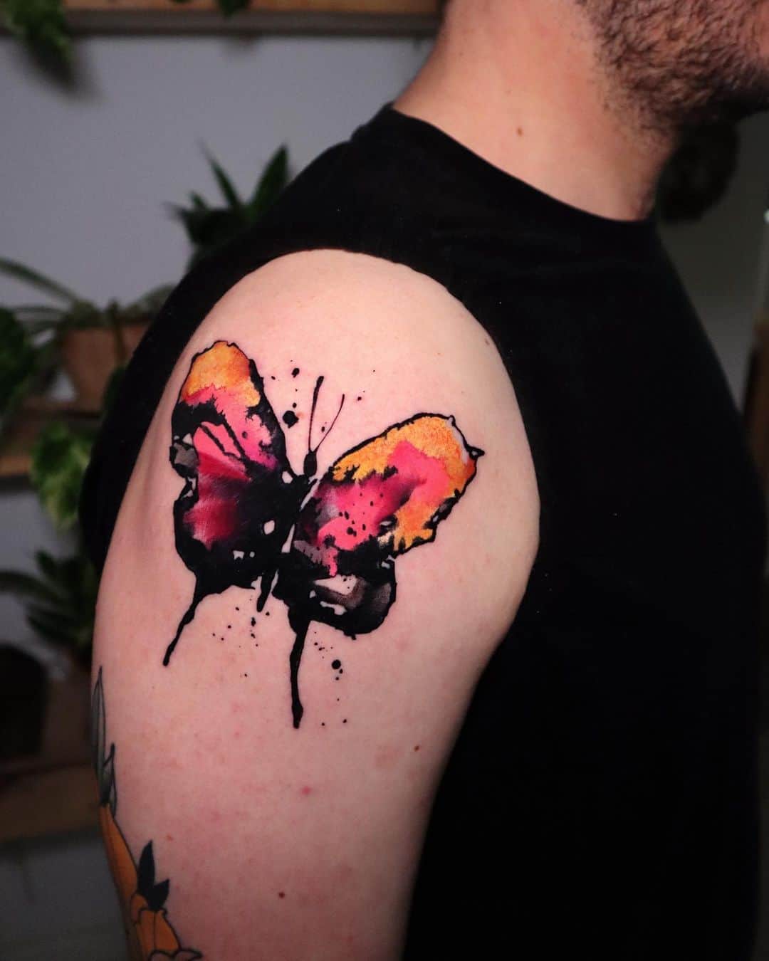 Colorful abstract butterfly tattoo by pablo ortiz tattoo 1