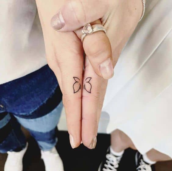 Cute half butterfly tattoo on finger