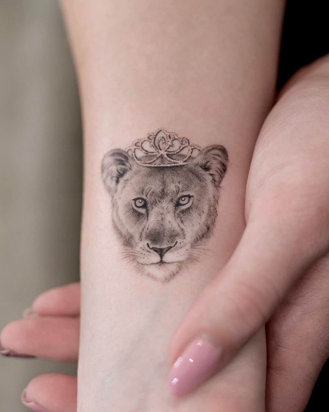 Cute lioness tattoo with crown by eternitytattooberlin