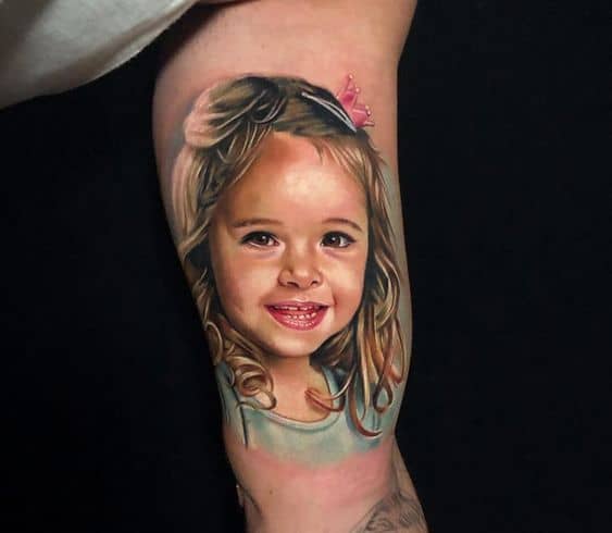 Cute little one portrait tattoo on arm