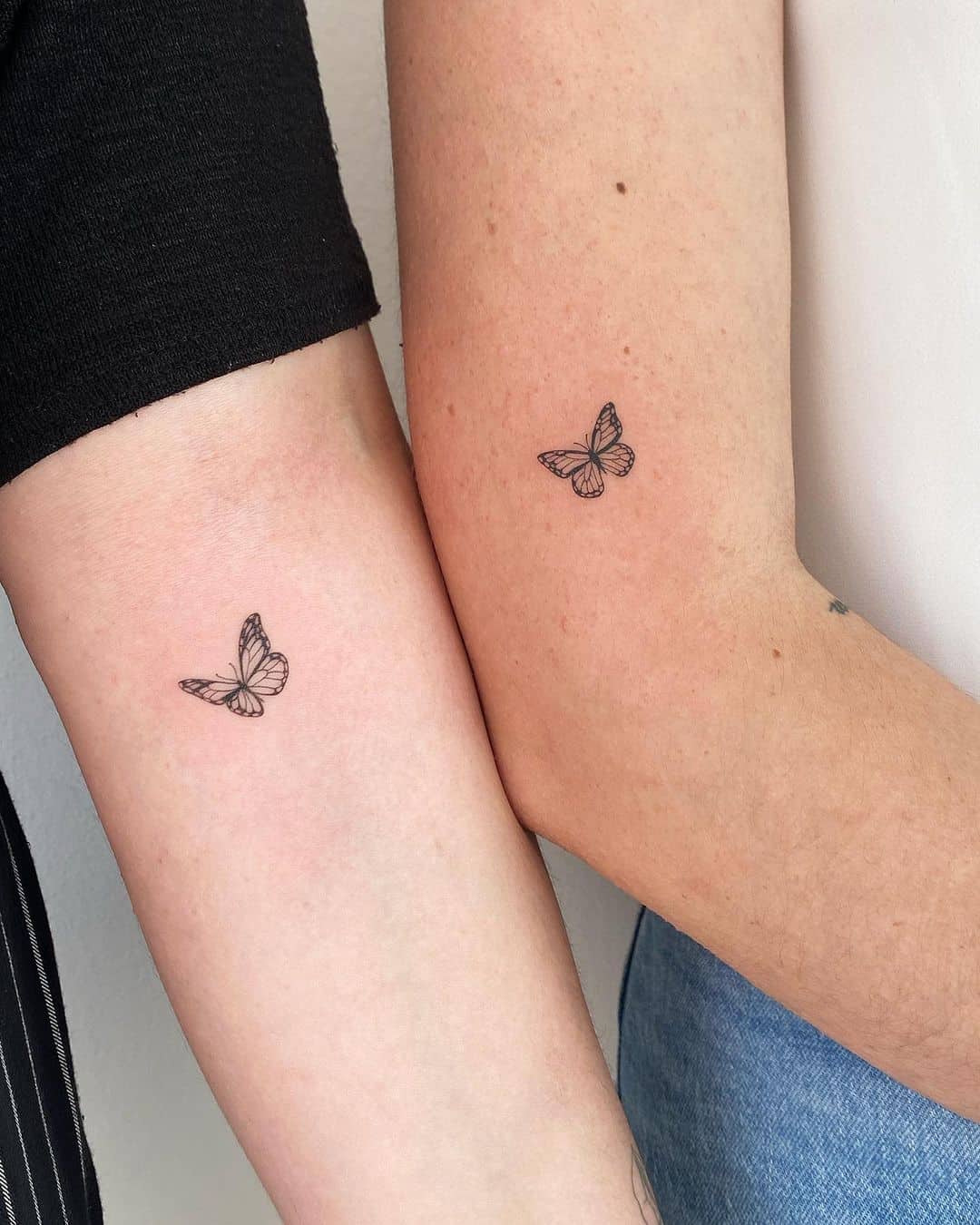 Cute matching butterfly tattoo on arm by joannamroman