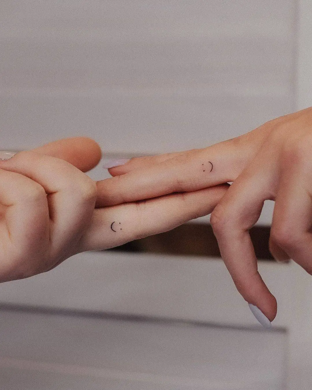 Cute matching tattoo on finger by tavi tattoo
