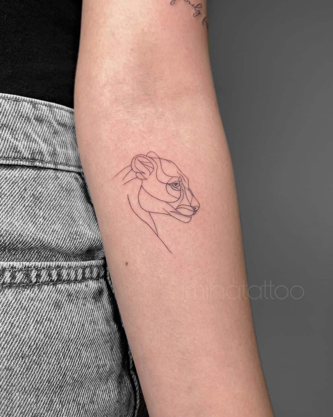 Fineline lion tattoo on arm by iminatattoo