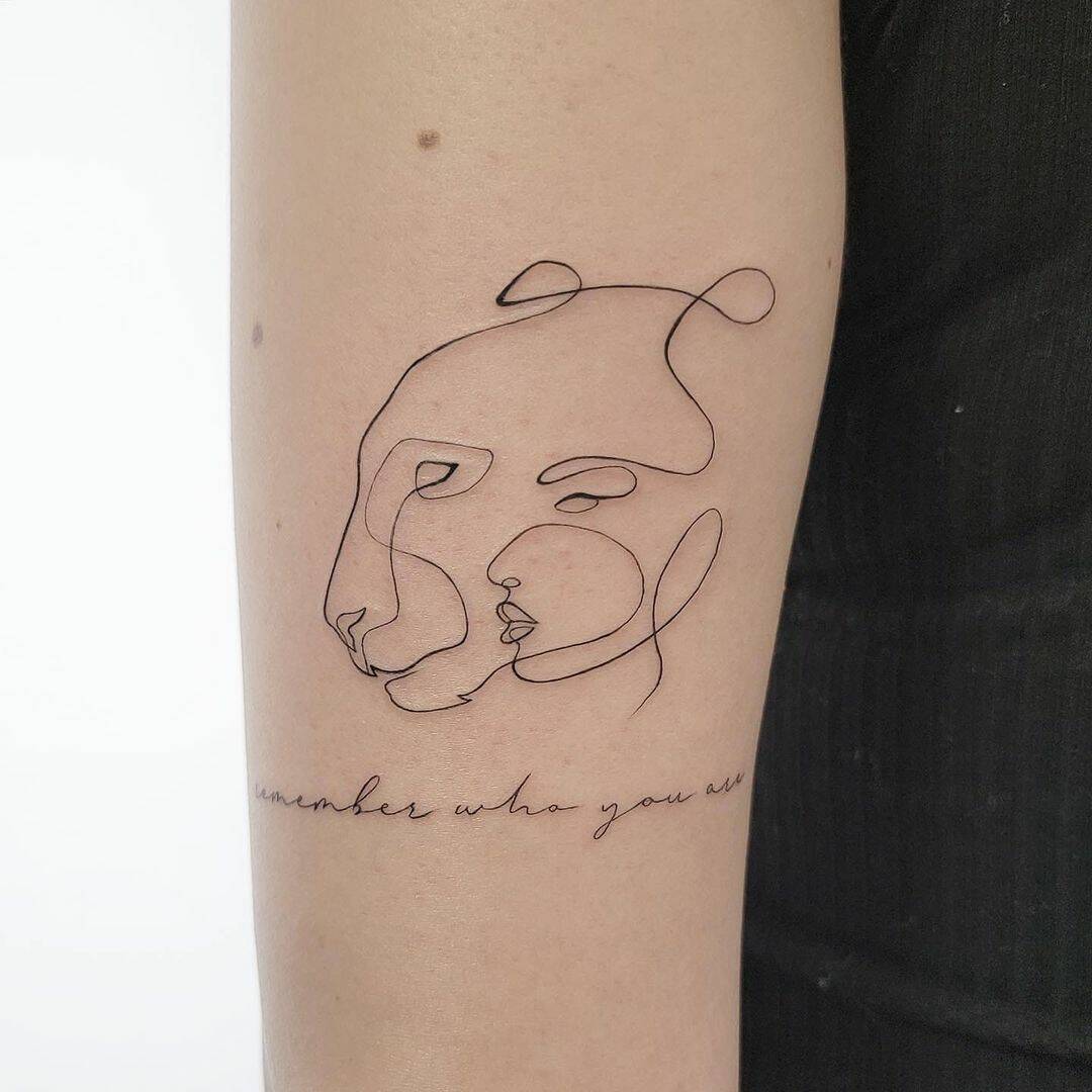 Fineline lion tattoo on arm by lazybones tattoo