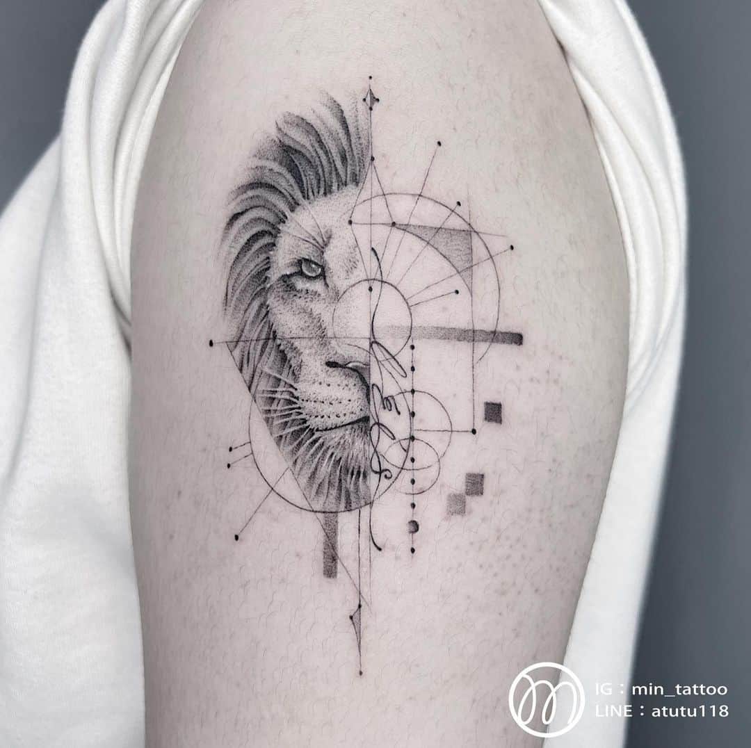 Geometric lion tattoo on upper arm by min tattoo