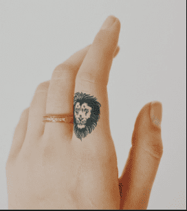 Lion tattoo on finger