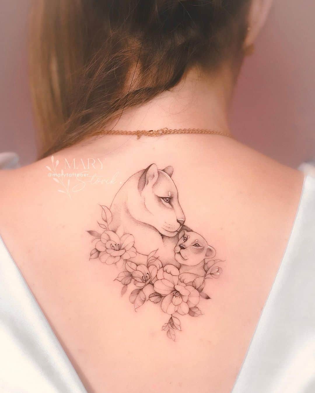 Lioness and cub tattoo with flower by marytattooer