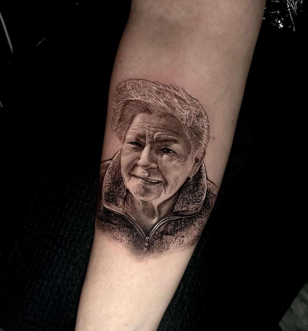 Old women portrait tattoo on arm by tattooist bk