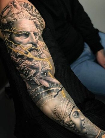REalistic greek god portrait tattoo on arm