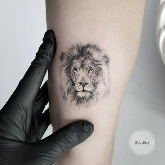 Realistic lion face tattoo