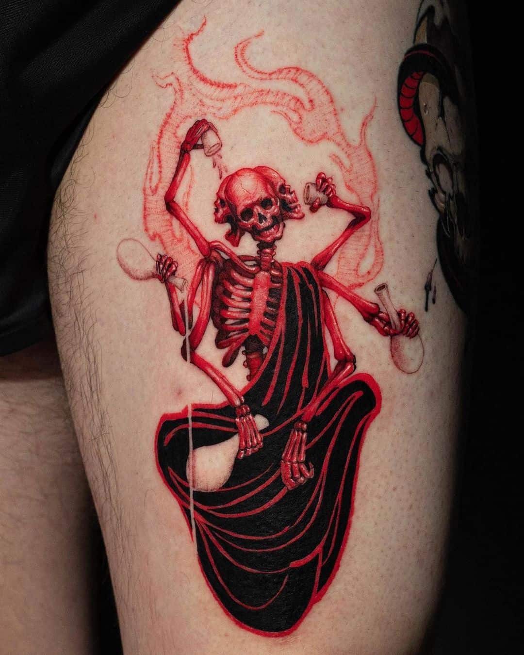 Red watercolor skull tattoo by inker land