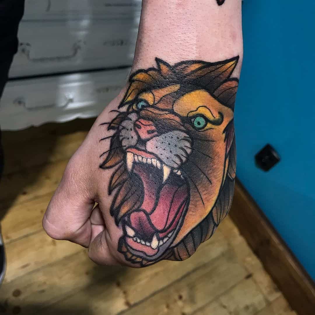 Roaring traditional tattoos on hand.
