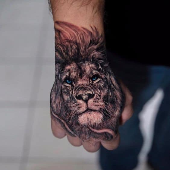 Small lion tattoo ith blue eyes