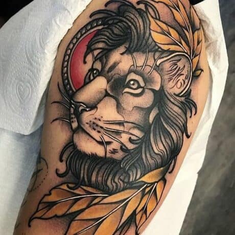 Traditional lion tattoo on upper arm