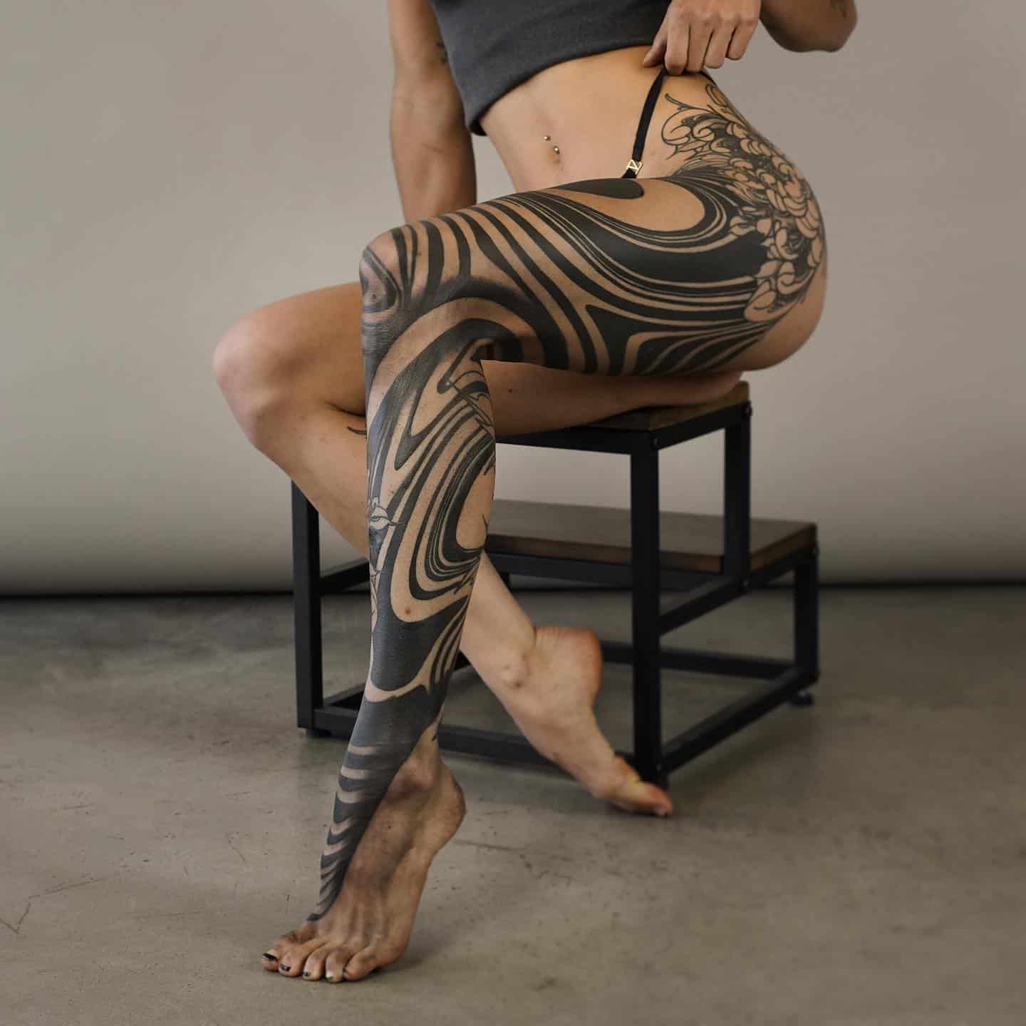 Wonderful abstract tattoo on full leg by orientedart