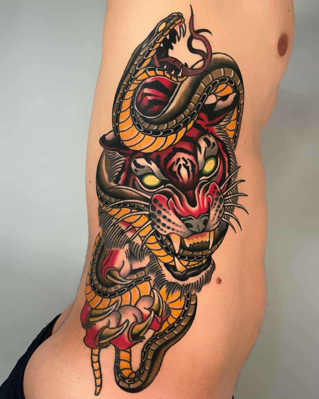 Amazing tiger with snake tattoo by ill mace