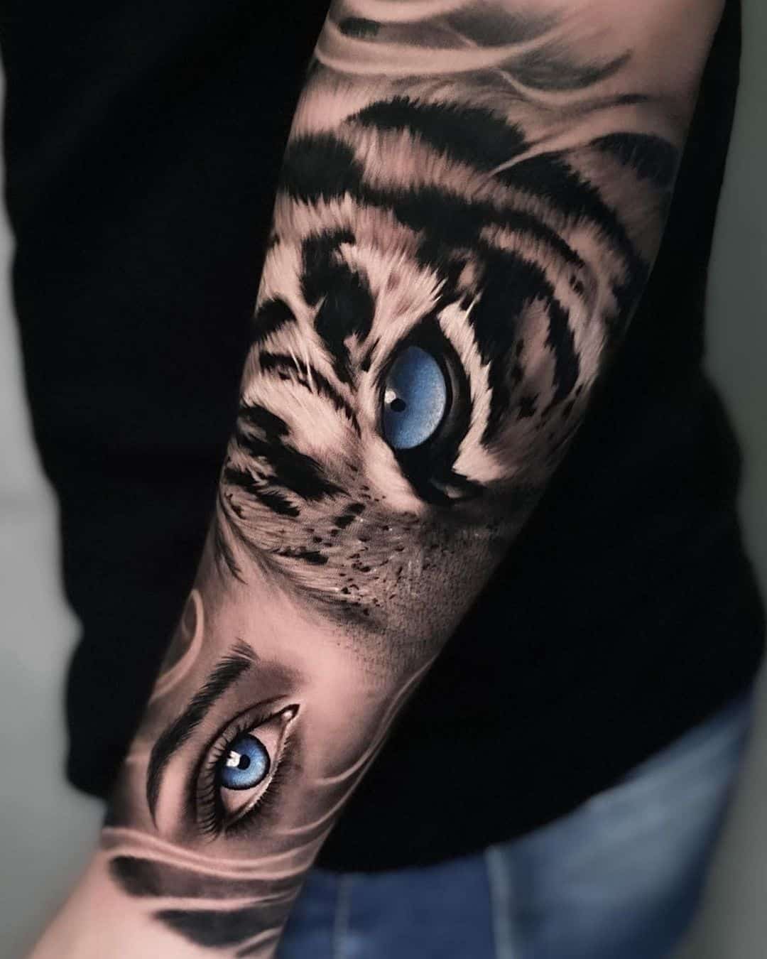 Beutiful tiger eye with humans eye tattoo by arkadtattoo