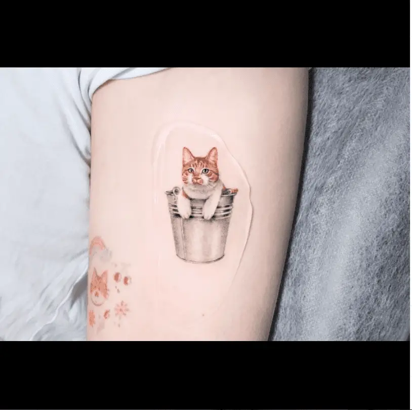 Cute caton bucket design by eins tattooer