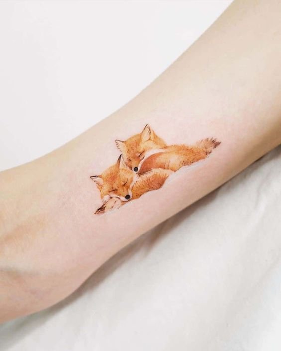 Cute foxes tattoo