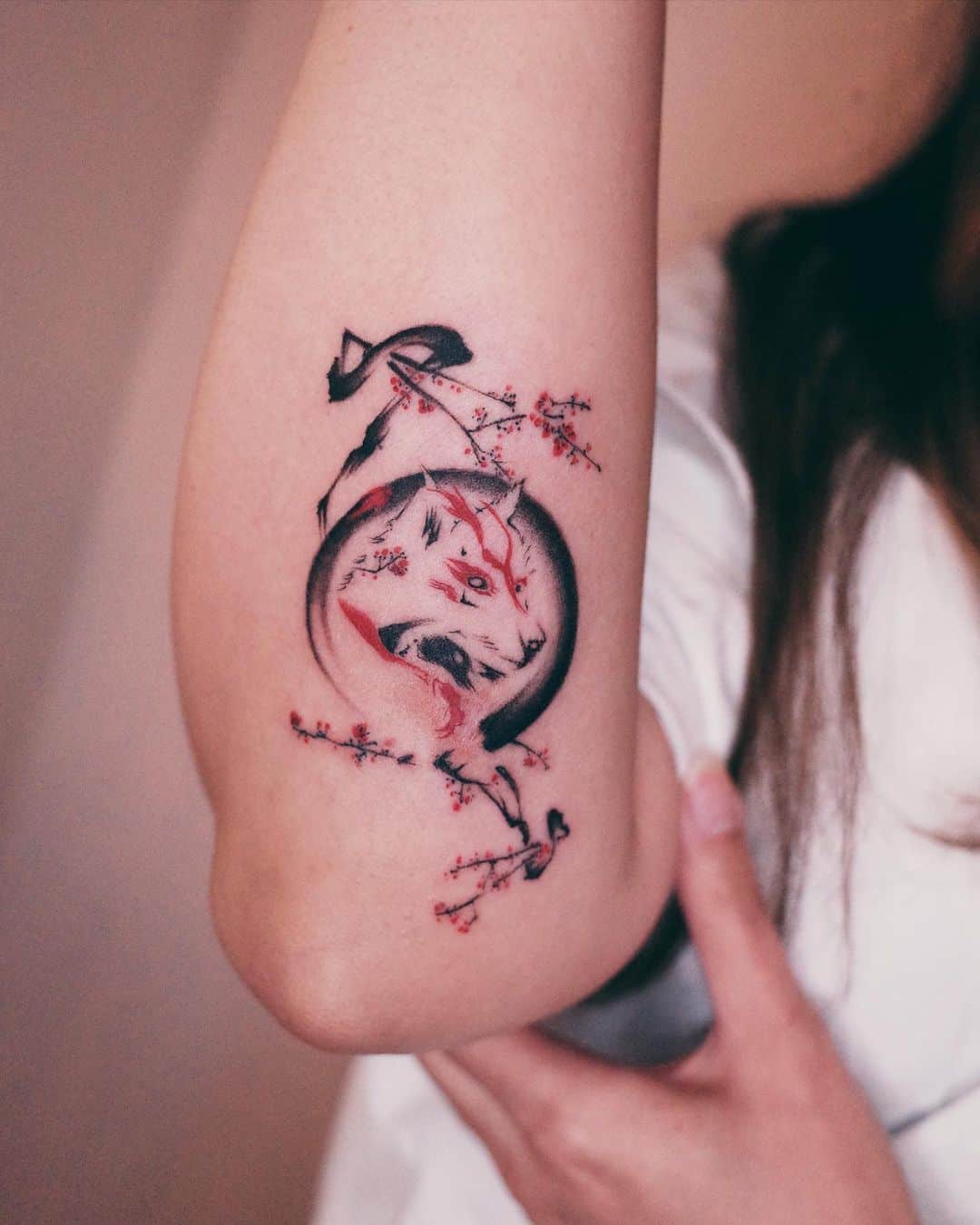 Japanese fox tattoo with cherry blossom design by tattooist arirang