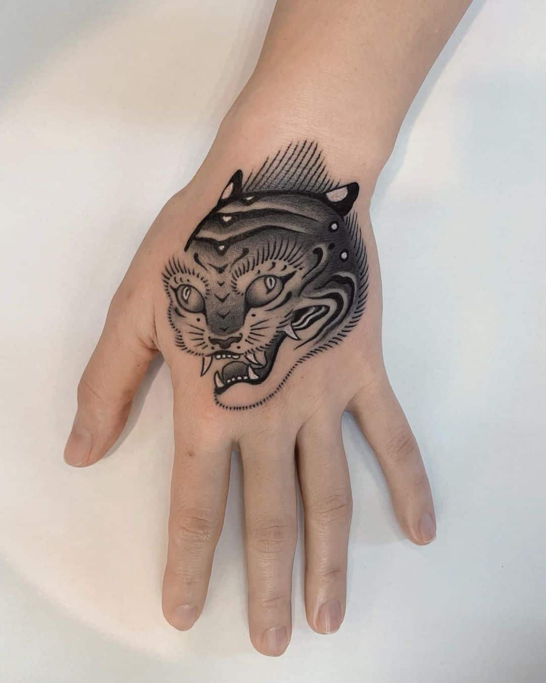 Korean tiger tattoo on hand by monique.pak