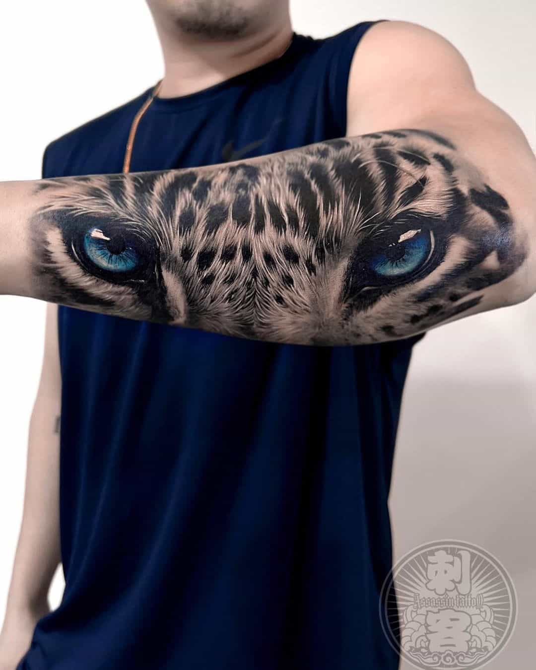 Leopard eye tattoo design on arm sleevs by sean assian tattoo