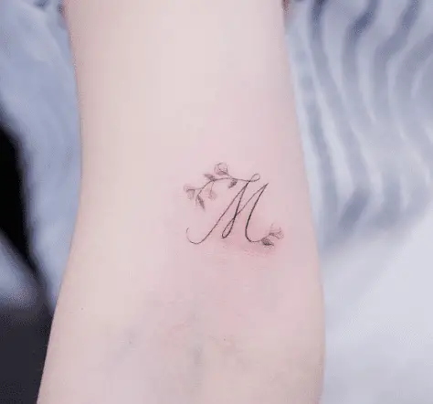 cursive letter m tattoo
