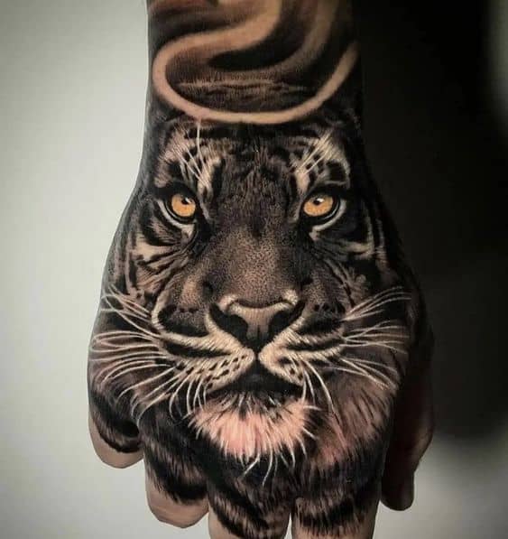 Realistic tiger tattoo on hand 2