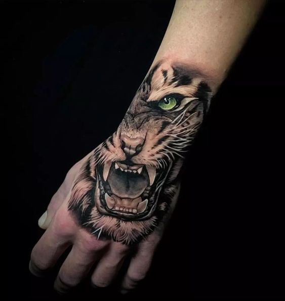 Rearing tiger tattoo on hand