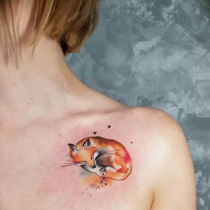 Sleeping fox tattoo on chest