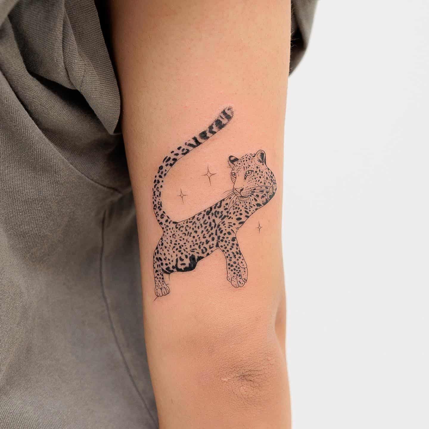 Sleeping leopard tattoo by lozzrachtattooer