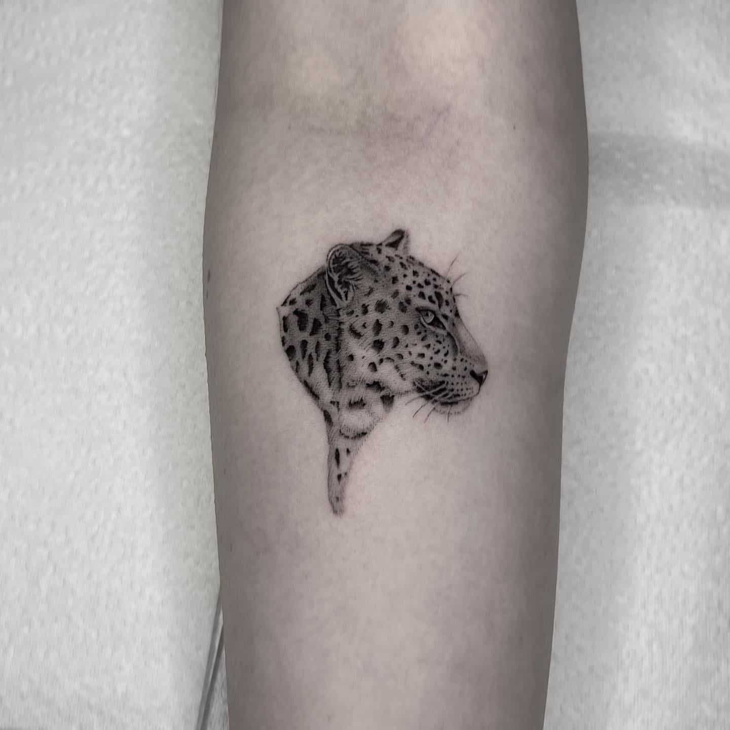 Small leopard tattoo by adam whelan tattoos