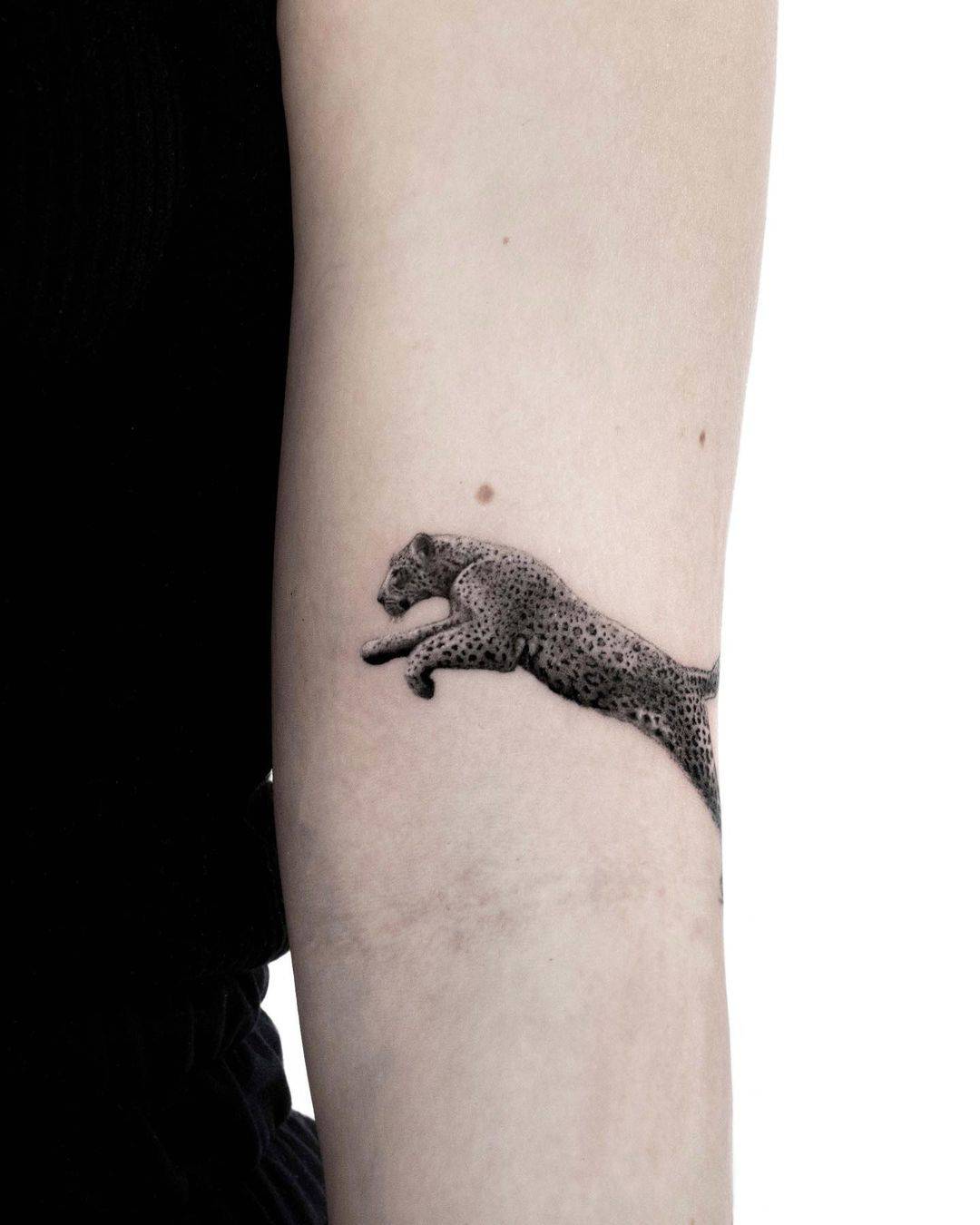 Small leopard tattoo by ievakempinaite