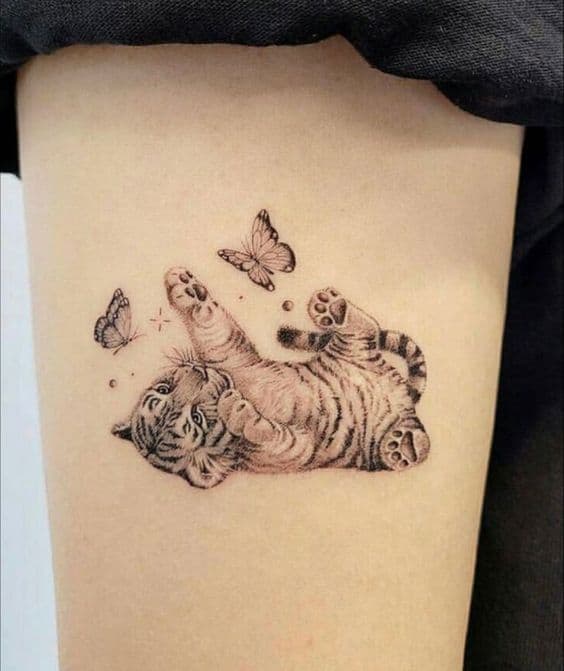 Tiger cub with butterfly tattoo