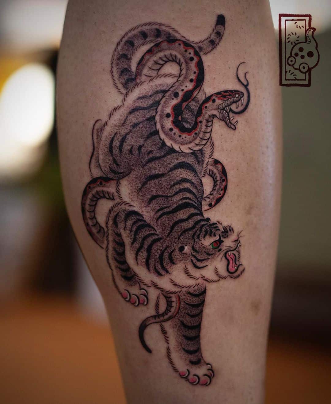 Tiger ith snake by heeno tattooer