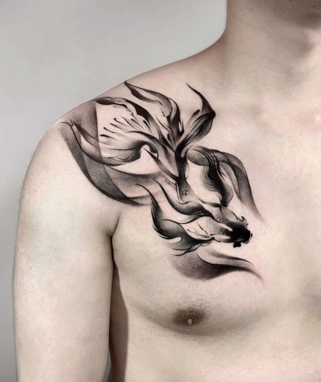 Abstrcat koi fish tattoo by jing.tattoo