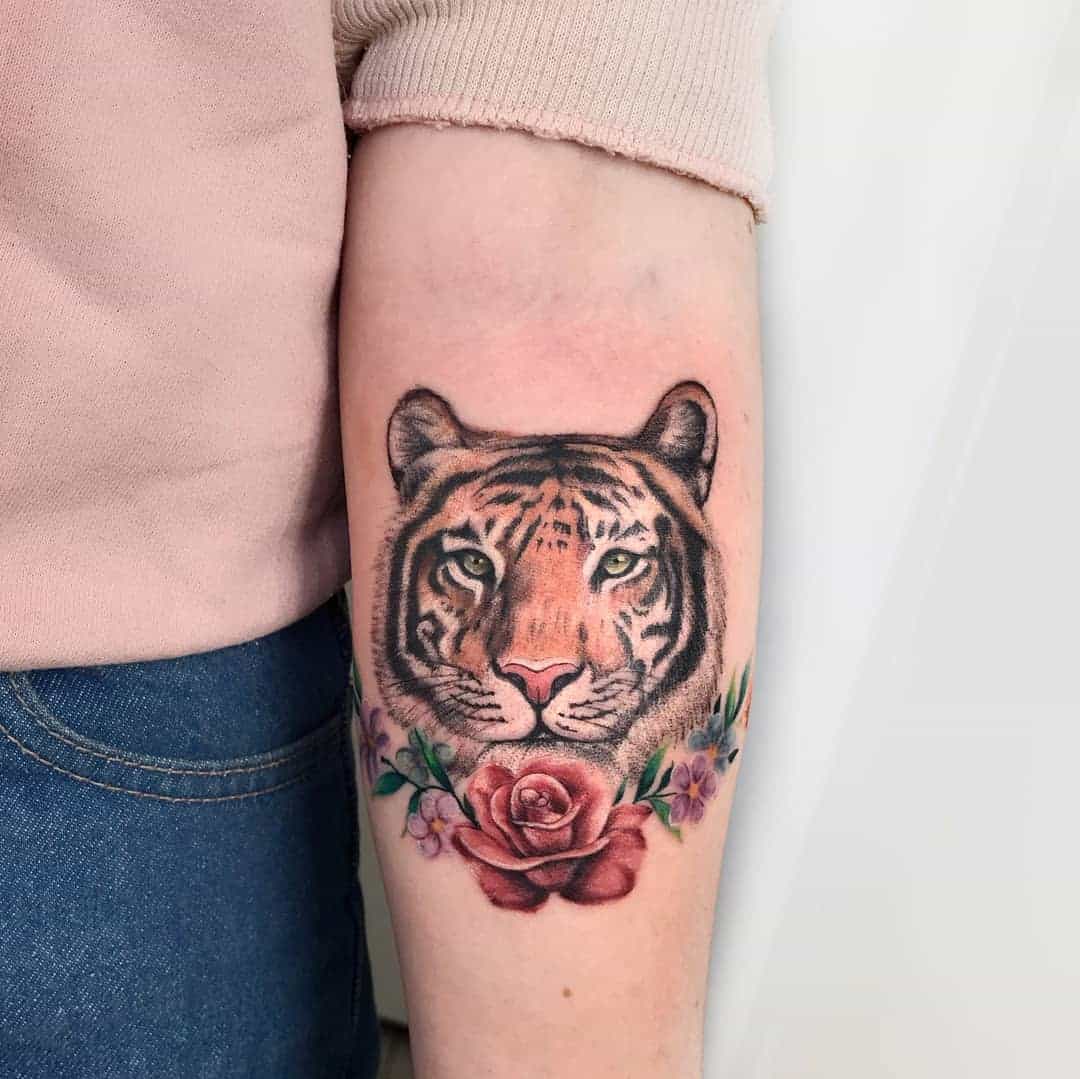 Amazing tiger with flower tattoo by zanatteo