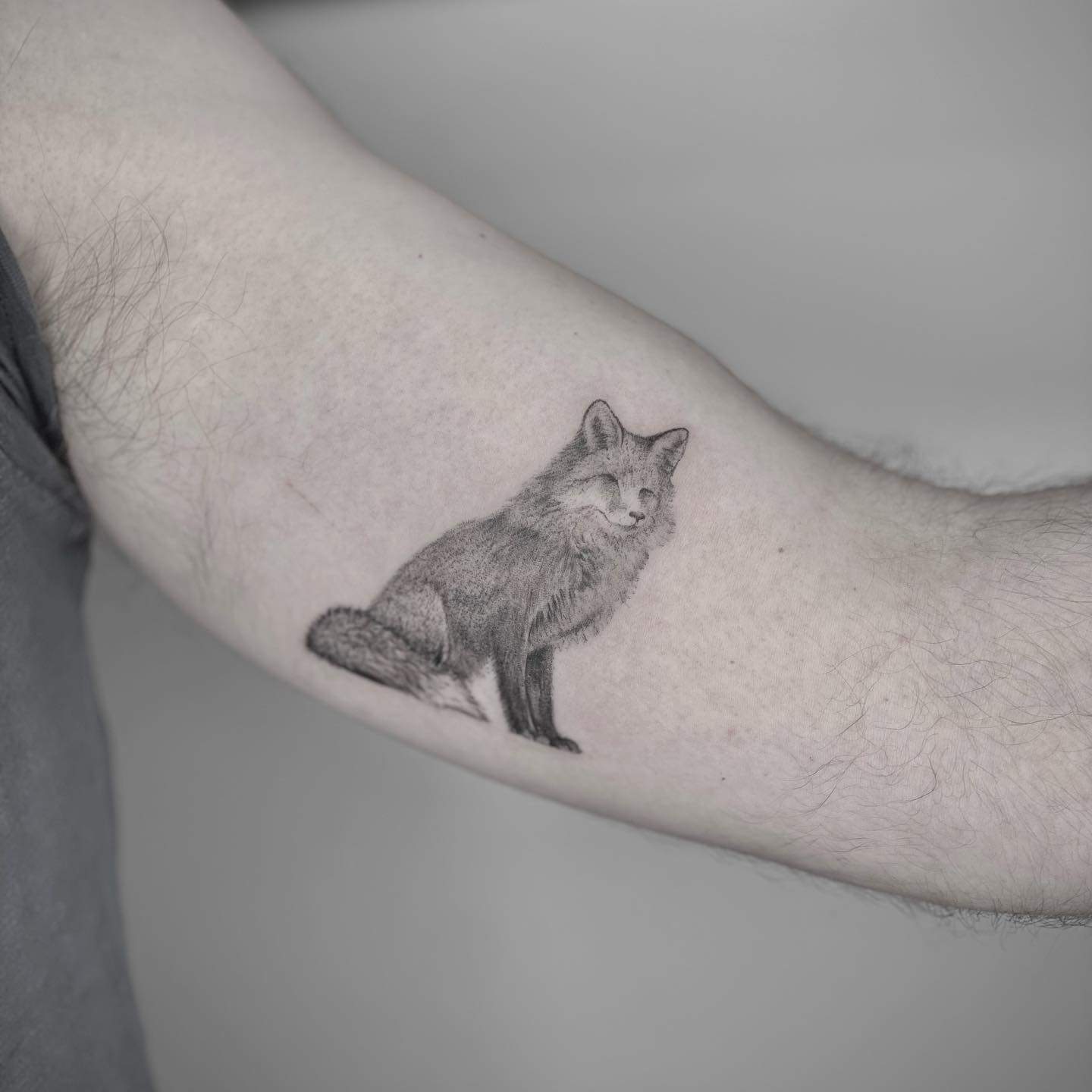 Black and gray fox tattoo by zap.ink