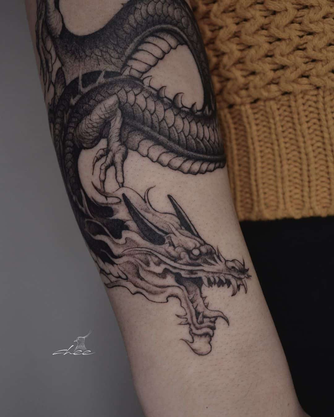 Dragon tattoo by chee.tattoo