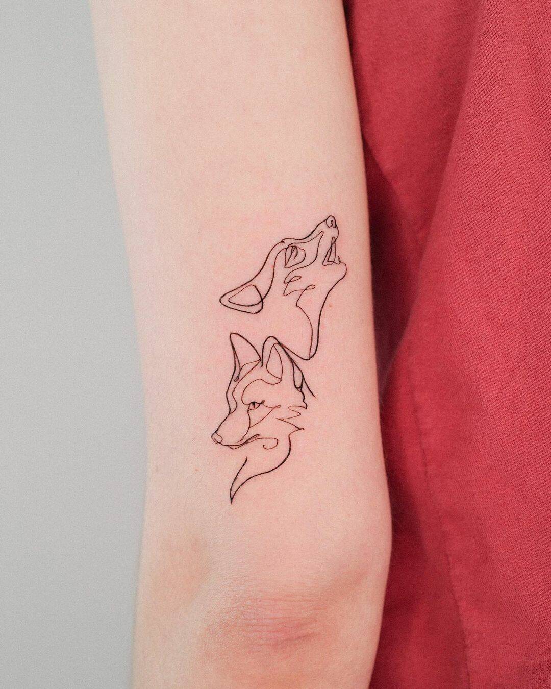 Fineline fox and wolf tattoo by guseul tattoo
