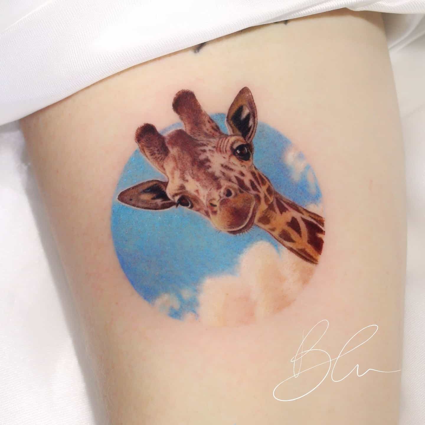 Giraffe tattoo by blu.tattoo