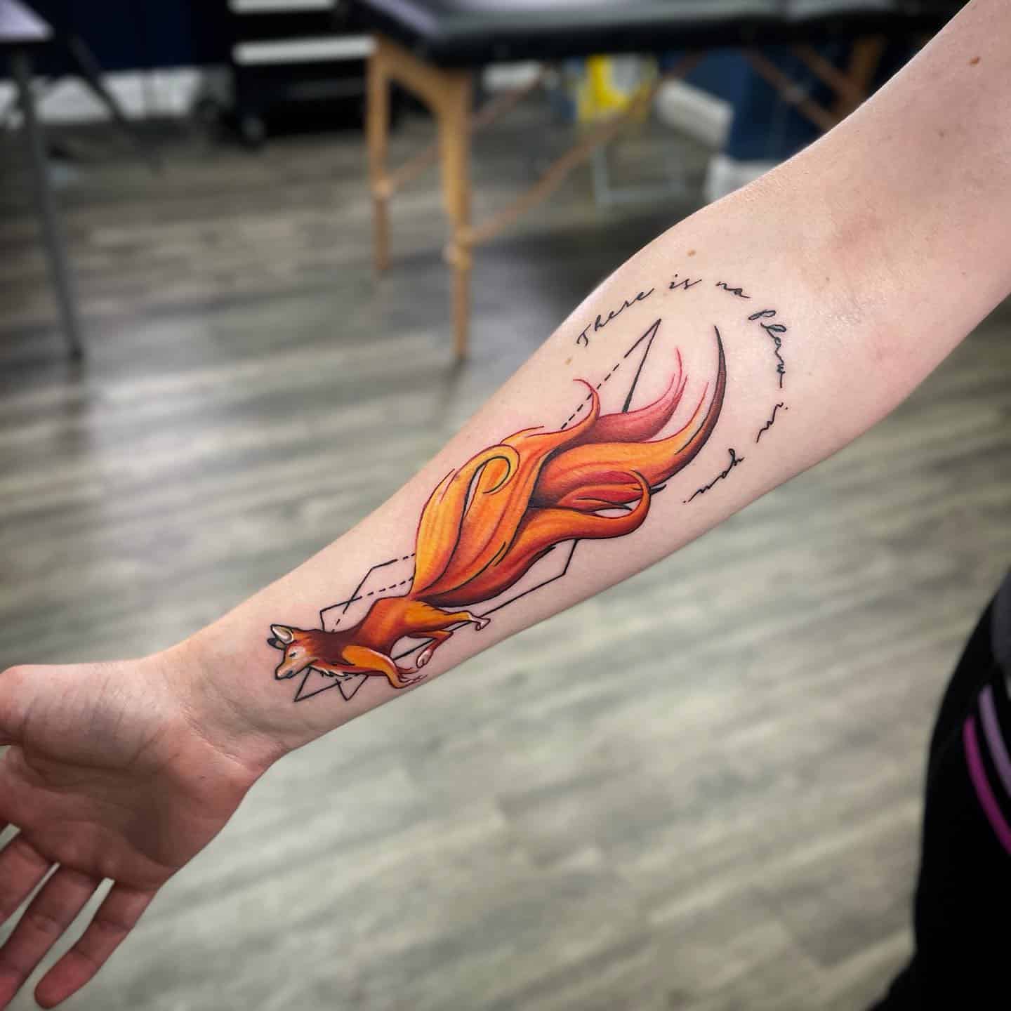 Nine tail fox tattoo on lower arm by zappinoats