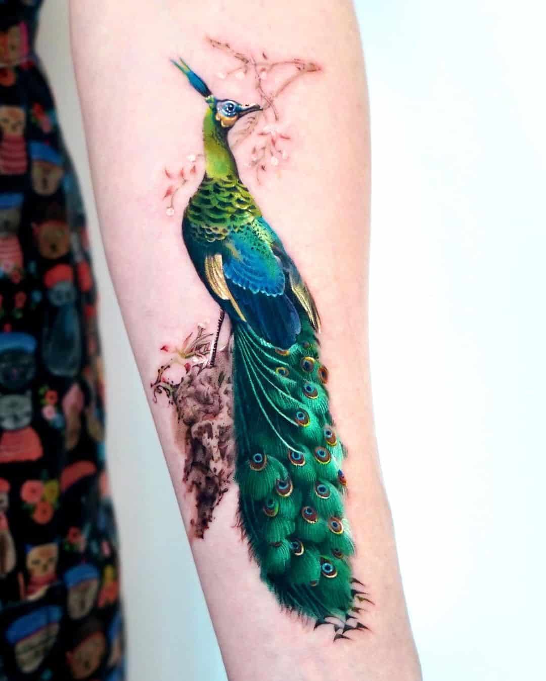 Peacock tattoo by mooongnyum tattoo