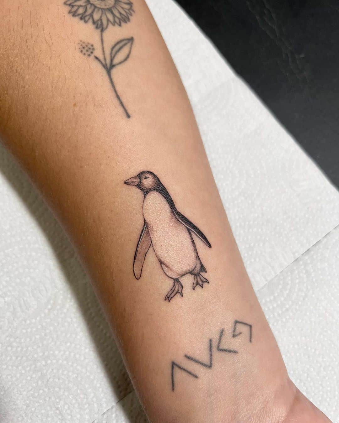 Penguin tattoo by tattuera