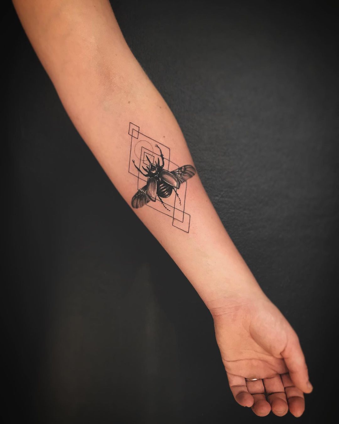 Scarab beetle tattoo by razone tattoo