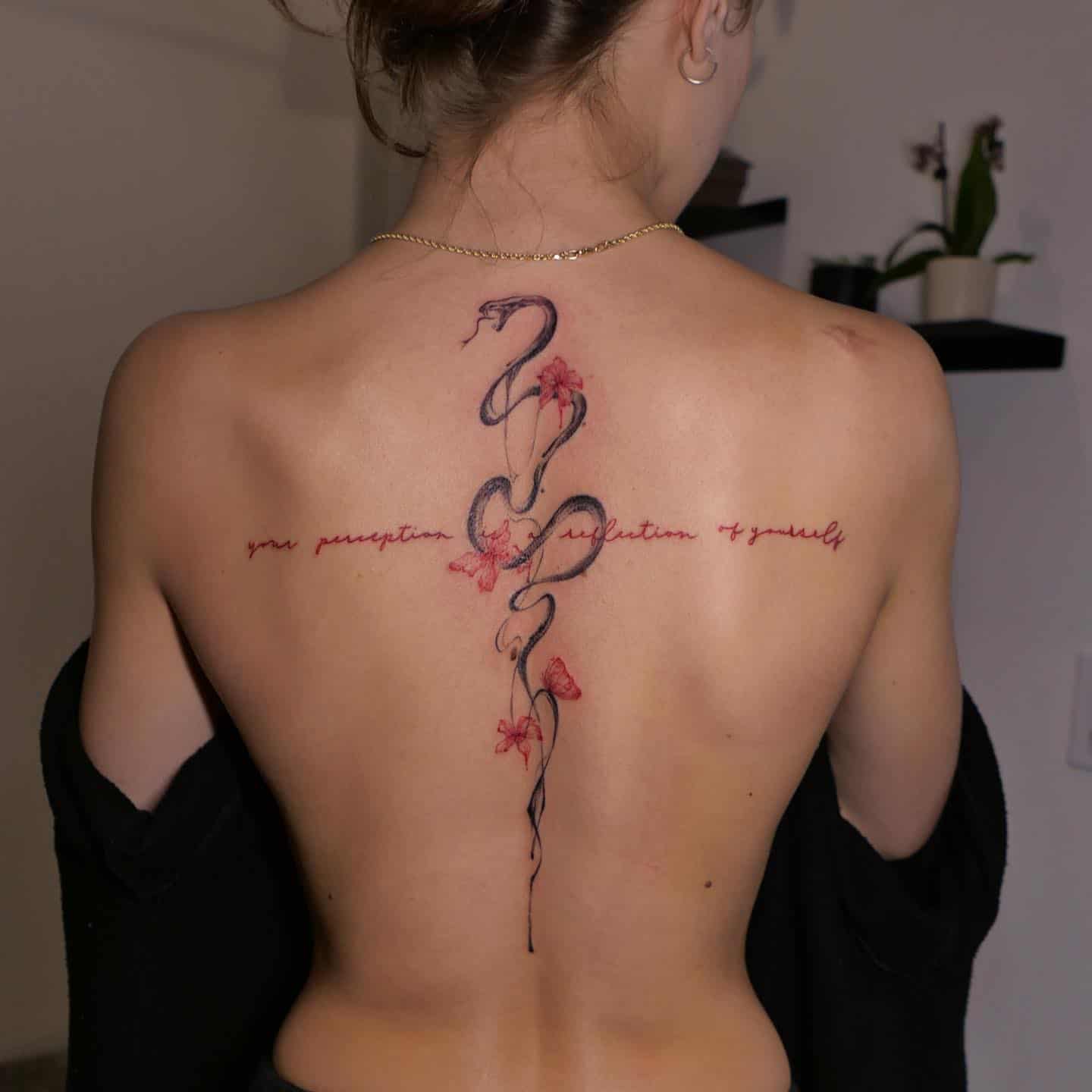Snake tattoo on back by jessieke