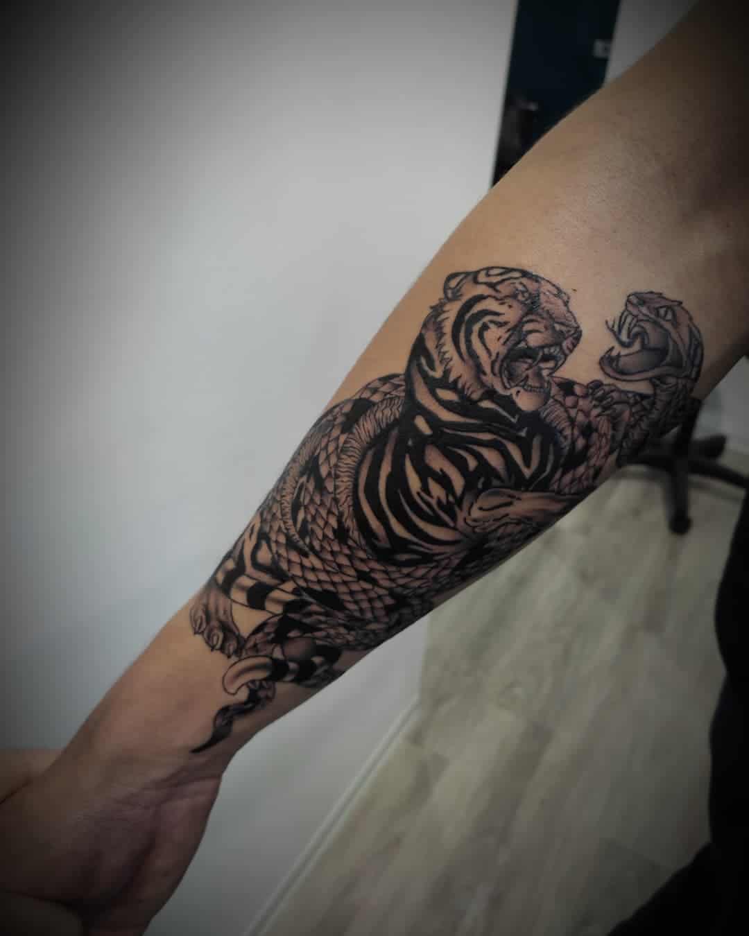 Tiger and snake tattoo deisgn by altattoo