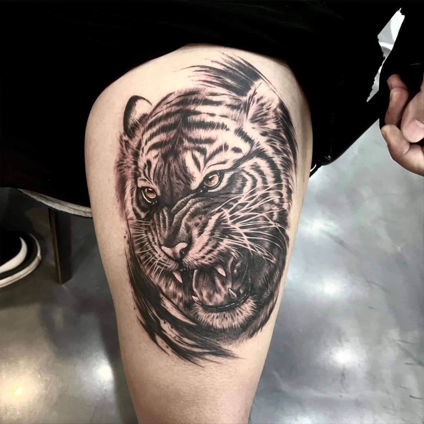 Tiger tattoo on legs by rica tattooer