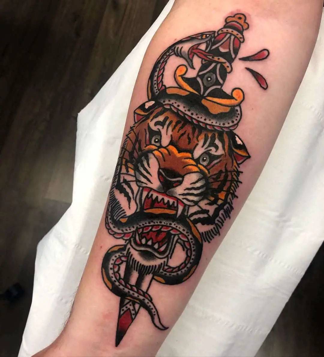 Traditional tiger tattoo with snake by mcilvennytattooer 1
