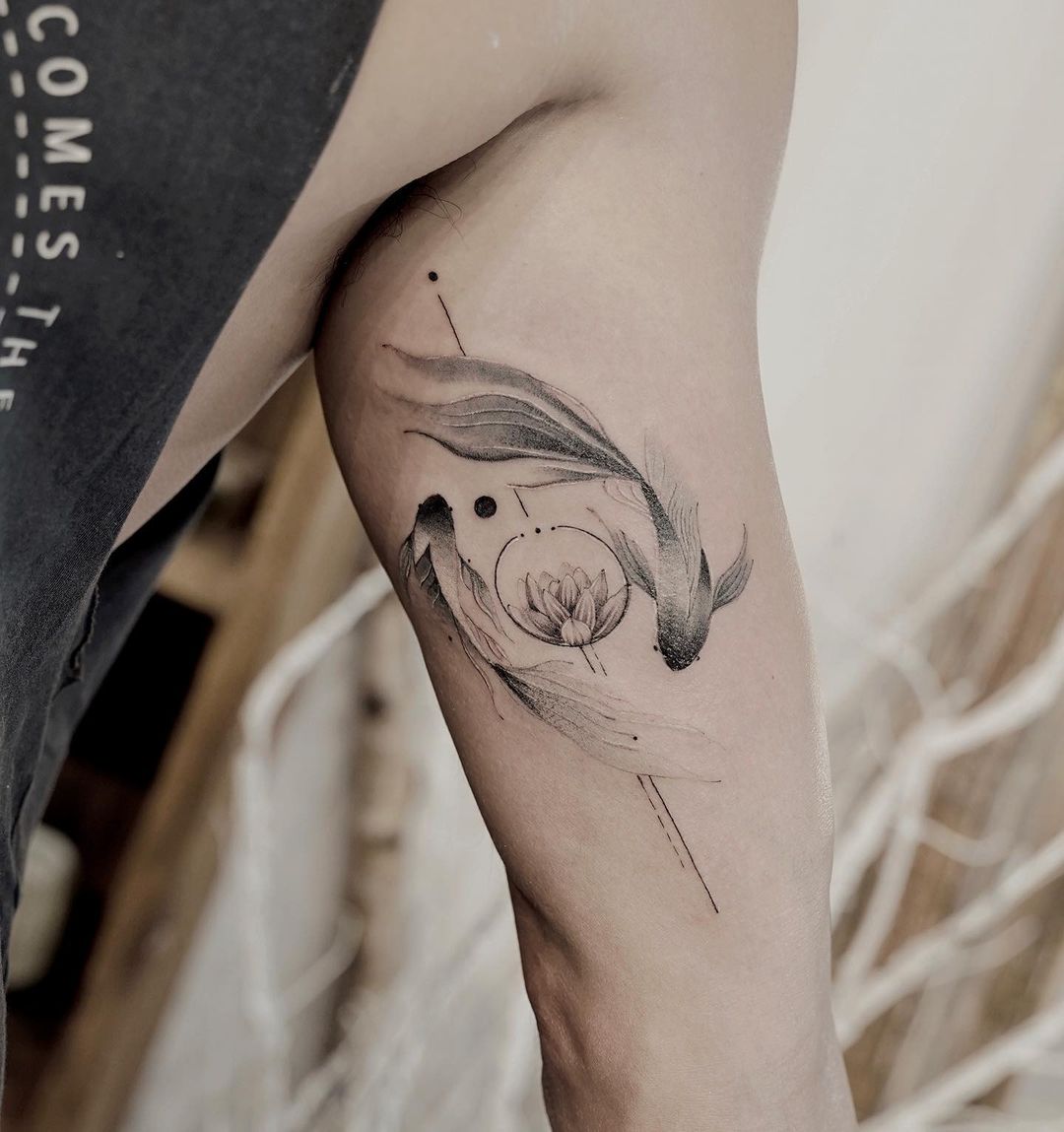 Two fish tattoo design by koizhou tattooist
